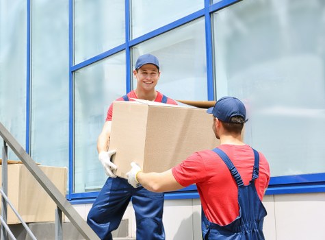 Removal van and packed boxes for a home move in Sutton