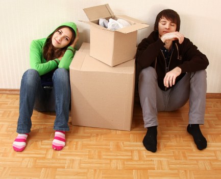 Removal team packing boxes safely in Sutton home