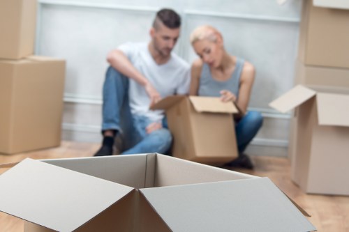 Removal team preparing household items for transport