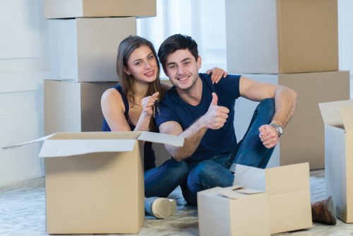 Local movers preparing fragile items for transport in Sutton