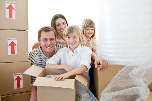 Workers assessing risks before lifting heavy furniture
