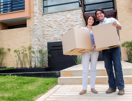 Loading furniture into a moving van in Sutton